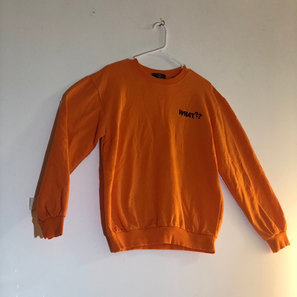 What? Orange sweater